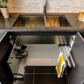 Storage designed by Ateliers Jacob for cabinets below the sink