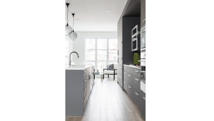 Contemporary Kitchen with central island and storage beneath.