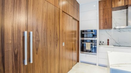 Modern Kitchen with central island and high-end appliances.