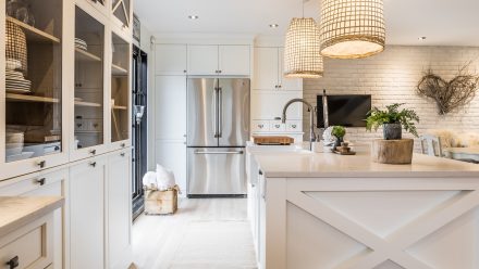 Rustic Kitchen with light-colored wood worktop and storage.