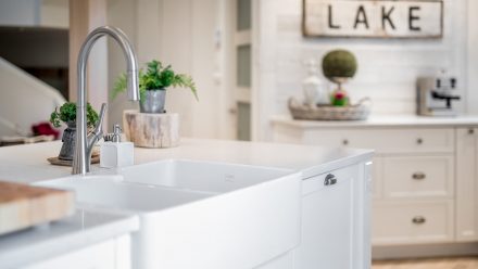 Beautiful kitchen with white cabinets and a bright countertop.