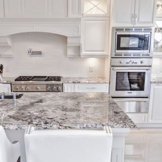 Classic Kitchen with central island and white cabinets.