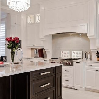 Spacious kitchen with central island and integrated storage.