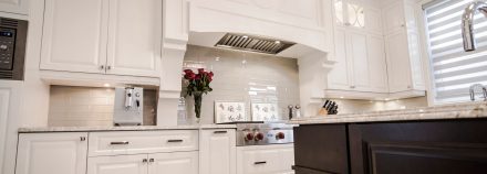 White kitchen with elegant countertops and cabinets in a bright spacious room.