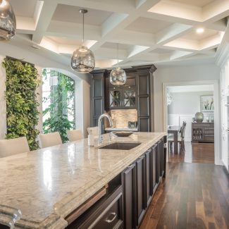 Classic Kitchen with white cabinets and stone countertops.