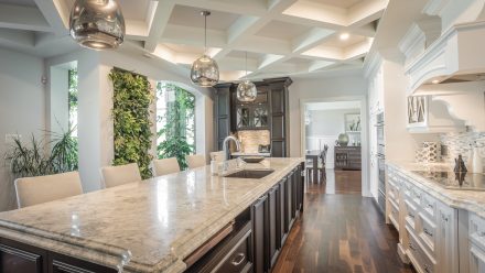 Classic Kitchen with white cabinets and stone countertops.