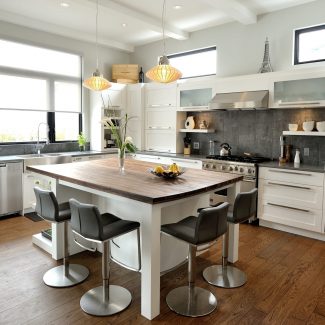 Fitted and bright kitchen with central island.