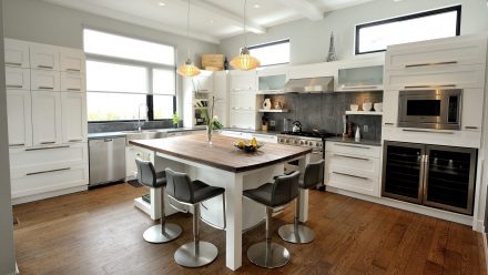 Fitted and bright kitchen with central island.