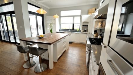 Elegant Kitchen with central island and functional storage cabinets.