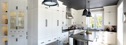 Spacious kitchen with grey and white tones.