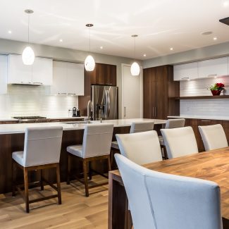 Modern Kitchen with spacious central island and light-colored countertop.