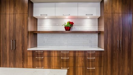 Spacious kitchen with sleek and modern lines with LED lighting under the cabinets.