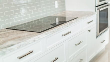 High-end kitchen with stone worktop, in a contemporary style.