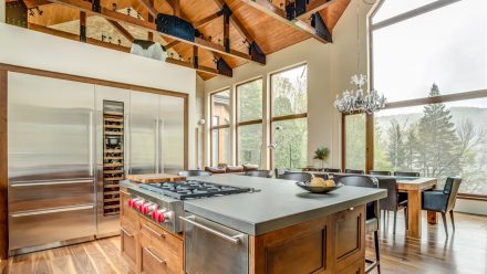 Modern Kitchen with central island and built-in refrigerators.