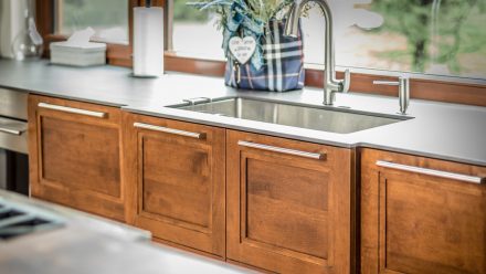 Kitchen with stone countertop and undermount sink.