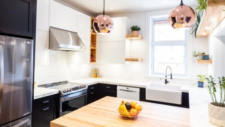 Contemporary Kitchen with central island and warm lighting in neutral tones.