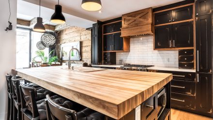 Modern Kitchen with a rustic feel, with a wooden counter and spacious central island.