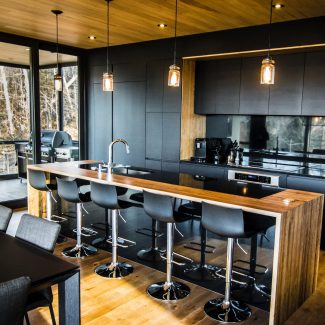 Contemporary Kitchen with central island and integrated appliances.