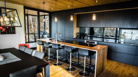 Contemporary Kitchen with central island and integrated appliances.