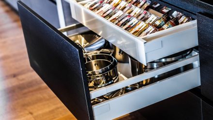 Kitchen with dark cabinets and functional storage.