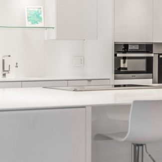 white kitchen with plenty of storage space.