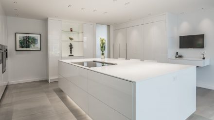 Modern Kitchen with central island and integrated appliances.