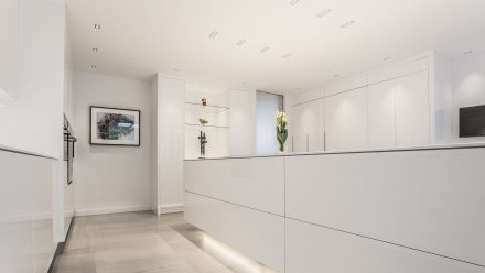 Modern and sleek Kitchen with a white central island.