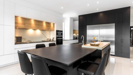 Sleek design of a spacious kitchen with neutral tones.