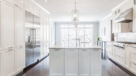 Bright kitchen with integrated storage and central island.