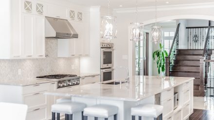 Elegant kitchen with central island and lighting under the cabinets.