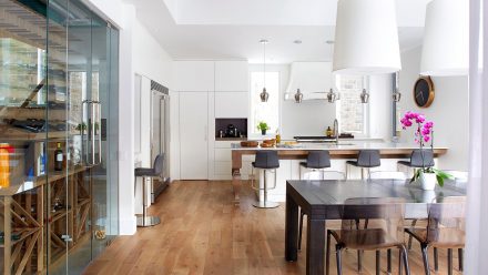 Spacious kitchen with lightcolored cabinets and a central island in an elegant and timeless style.