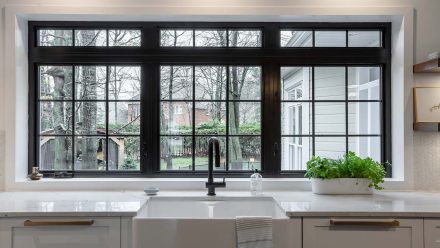 Bright and spacious kitchen in shades of white and gray.