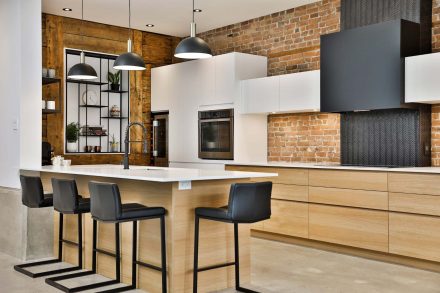 Modern Kitchen with neutral tones and stone countertops.