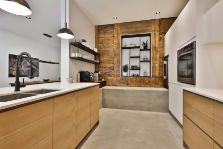 Elegant white kitchen counter with refined drawers and handles.