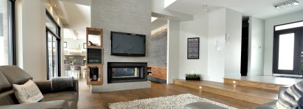 Spacious and sleek interior of a modern house with a view of nature.