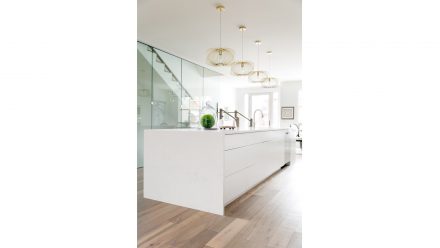 Contemporary white Kitchen with elegant countertops and streamlined cabinets.