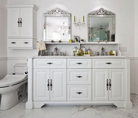 Classic bathroom with white cabinets.