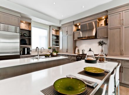Elegant decoration of a modern kitchen with a central island and white countertop.