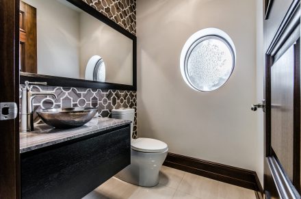 Contemporary bathroom with hidden drawers and handles.