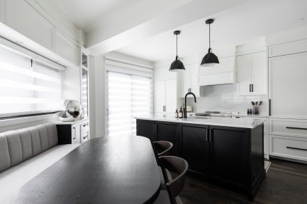 Modern kitchen layout with integrated lighting in a large open space.