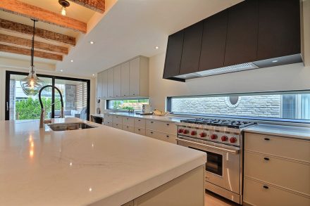 Spacious modern kitchen with huge kitchen island.