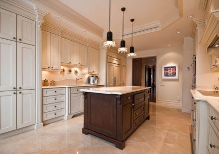 White Kitchen with a classic style featuring a central island and white work surface.