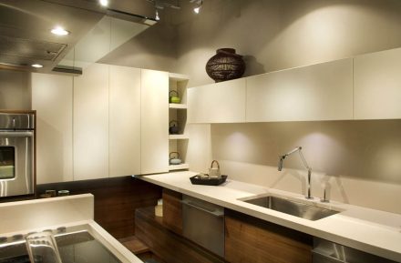 Contemporary Kitchen with island and high-quality appliances in a bright room.