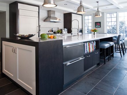 Stylish kitchen furniture with a light-colored worktop.