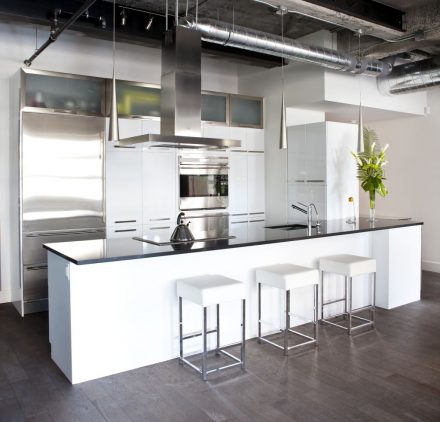 White furniture with glass doors and shelves.