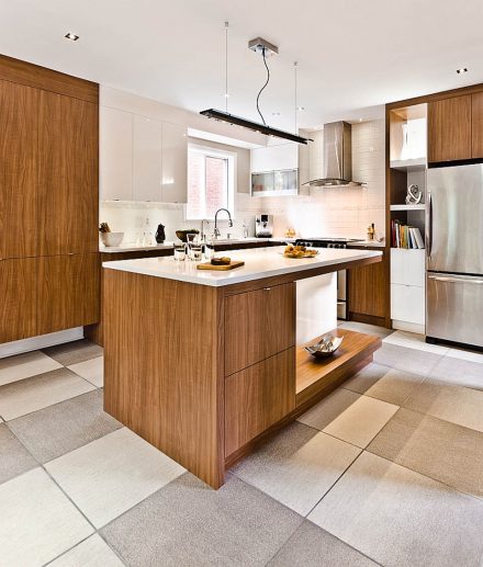 Elegant Kitchen with central island and white cabinets.