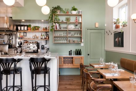 Rustic Kitchen with light countertops and white cabinets.