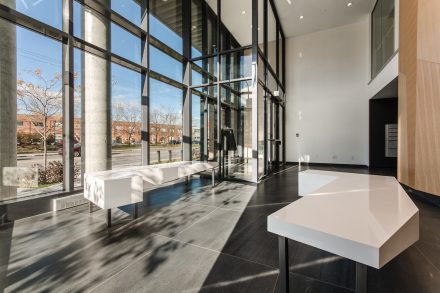 Modern entrance hall with warm lighting and elegant design.