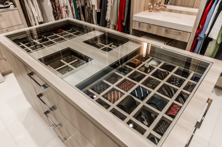 Layout of spacious closet with shelves and clothing rods.