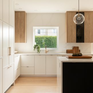 Airy kitchen with white, black and oak cabinets 